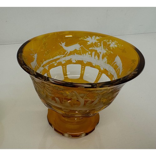 193 - Wheel cut amber glass bowl decorated with deer in a woodland setting, 13 cm diameter x 10.5 cm high.... 