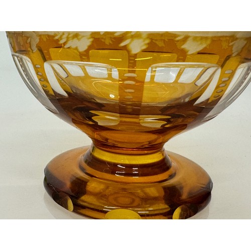 193 - Wheel cut amber glass bowl decorated with deer in a woodland setting, 13 cm diameter x 10.5 cm high.... 