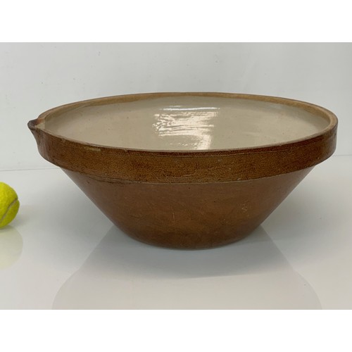 197 - Kitchenalia, a glazed stoneware mixing bowl, 40 cm in diameter x 17 cm high.

This lot is available ... 