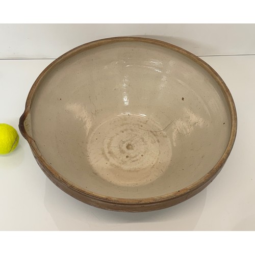 197 - Kitchenalia, a glazed stoneware mixing bowl, 40 cm in diameter x 17 cm high.

This lot is available ... 