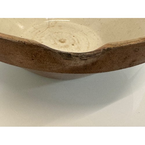 197 - Kitchenalia, a glazed stoneware mixing bowl, 40 cm in diameter x 17 cm high.

This lot is available ... 