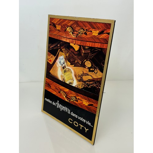 206 - An embossed advertising display sign for Coty perfume, 41.5 cm x 30 cm.

This lot is available for i... 