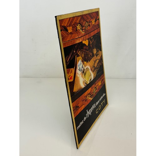 206 - An embossed advertising display sign for Coty perfume, 41.5 cm x 30 cm.

This lot is available for i... 