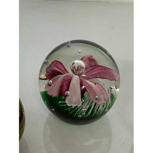 216 - Three decorative glass paperweights. 13 cm 7 cm and 6 cm high.

This lot is available for in-house s... 