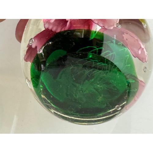 216 - Three decorative glass paperweights. 13 cm 7 cm and 6 cm high.

This lot is available for in-house s... 