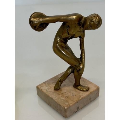 273 - Cast figure of a discus thrower on a marble base, 14 cm high.

This lot is available for in-house sh... 