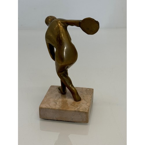 273 - Cast figure of a discus thrower on a marble base, 14 cm high.

This lot is available for in-house sh... 