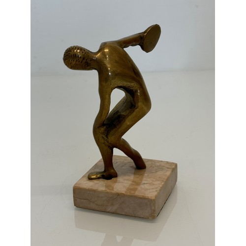 273 - Cast figure of a discus thrower on a marble base, 14 cm high.

This lot is available for in-house sh... 