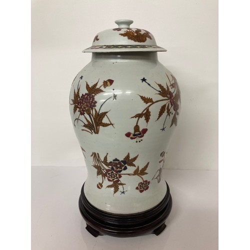 190 - Chinese pottery lidded vase on later stand, 16 inches high. Chip to underside of the lid and hairlin... 