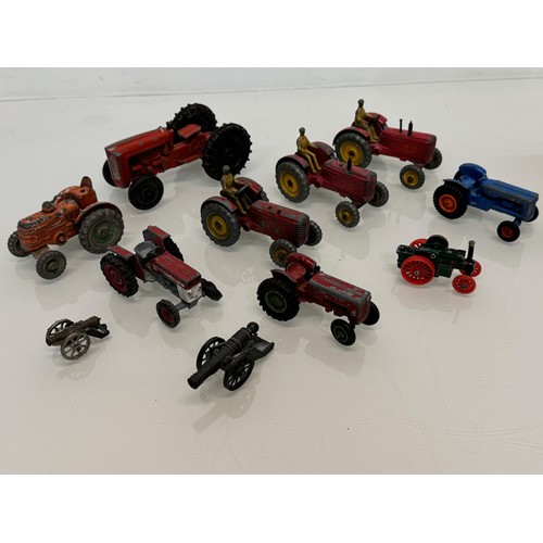 353 - Die cast toys, a collection of tractors and two model cannons. Dinky Corgi etc.

This lot is availab... 