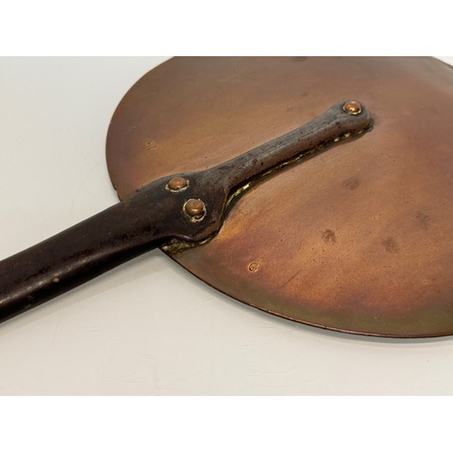 21 - Kitchenalia, a large copper and wrought iron pan lid, 31 cm  diameter x 56.5 cm long.

This lot is a... 