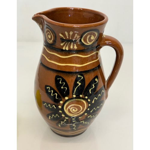 245 - A slip decorated stoneware jug, unmarked studio pottery, 23 cm high.

This lot is available for in-h... 