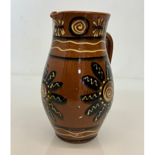 245 - A slip decorated stoneware jug, unmarked studio pottery, 23 cm high.

This lot is available for in-h... 