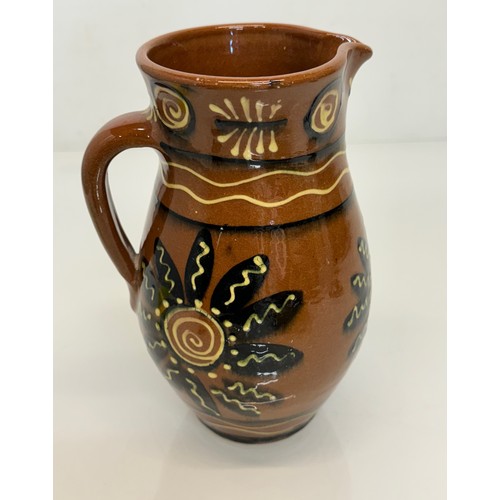 245 - A slip decorated stoneware jug, unmarked studio pottery, 23 cm high.

This lot is available for in-h... 