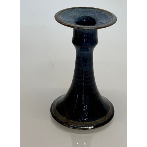 540 - Irish art pottery candle stick, signed to the base, 16 cm tall.

This lot is available for in-house ... 