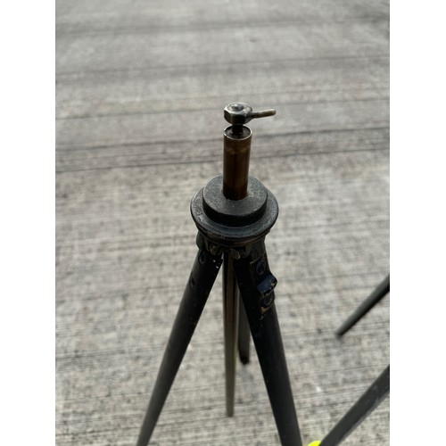 76 - Two metal tripod stands, for cameras or scientific equipment. 104 cm and 88 cm tall respectfully.

T... 