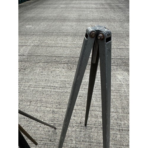 76 - Two metal tripod stands, for cameras or scientific equipment. 104 cm and 88 cm tall respectfully.

T... 