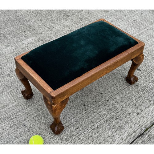 93 - Footstool with ball and claw feet and green velvet upholstery, 62 cm x 35 cm x 29 cm tall.

This lot... 