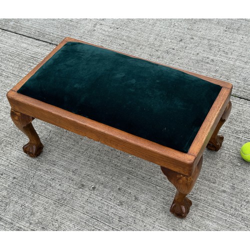 93 - Footstool with ball and claw feet and green velvet upholstery, 62 cm x 35 cm x 29 cm tall.

This lot... 