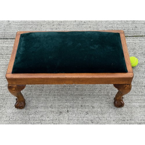 93 - Footstool with ball and claw feet and green velvet upholstery, 62 cm x 35 cm x 29 cm tall.

This lot... 