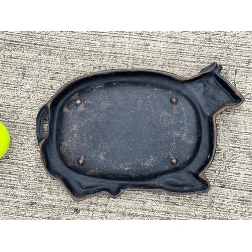 95 - Cast iron dish fitted within the centre of a seated cow form, 32 cm x 22cm 

This lot is available f... 