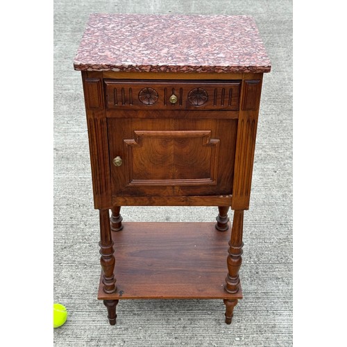 101 - French country furniture, a marble topped walnut bedside cupboard on raised legs, with an undershelf... 