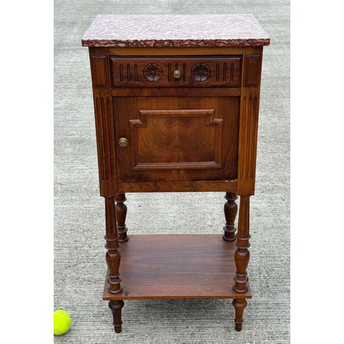 101 - French country furniture, a marble topped walnut bedside cupboard on raised legs, with an undershelf... 