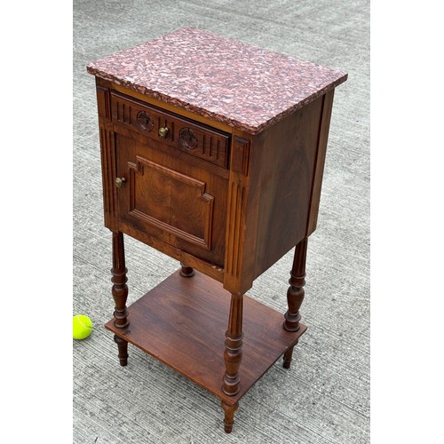 101 - French country furniture, a marble topped walnut bedside cupboard on raised legs, with an undershelf... 