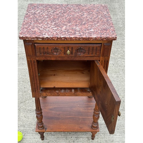 101 - French country furniture, a marble topped walnut bedside cupboard on raised legs, with an undershelf... 