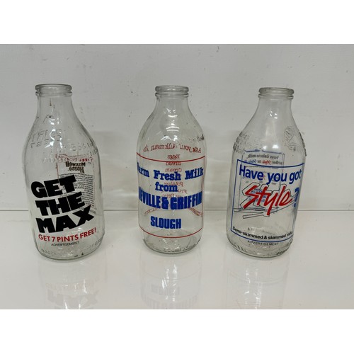 164 - A collection of advertising themed glass milk bottles.

This lot is available for in-house shipping