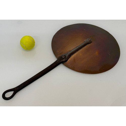 329 - Kitchenalia, large copper pan lid with a wrought iron handle, 35 cm diameter x 63 cm long.

This lot... 