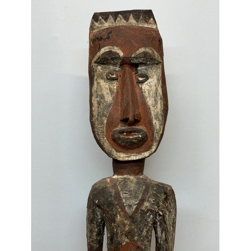 132 - Tribal art, hand carved and painted a large figure from New Guinea, 96 cm tall.

This lot is availab... 