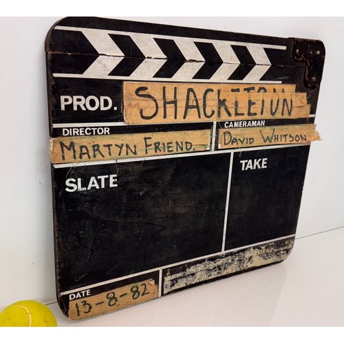 27 - Movie ,Film memorabilia, a vintage wooden clapper board , marked for the TV series Shackleton and da... 