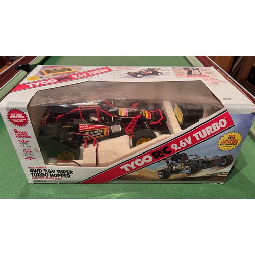 62 - Radio Control 4WD Tyco Racing Car, boxed. 52 cm x 24 cm x 23 cm.

This lot is available for in-house... 