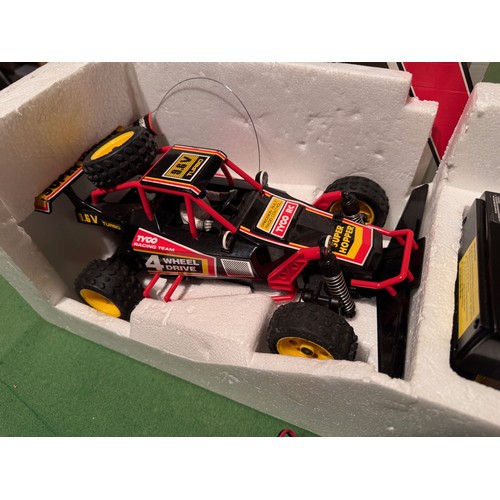 62 - Radio Control 4WD Tyco Racing Car, boxed. 52 cm x 24 cm x 23 cm.

This lot is available for in-house... 