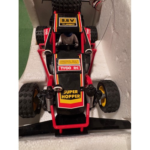 62 - Radio Control 4WD Tyco Racing Car, boxed. 52 cm x 24 cm x 23 cm.

This lot is available for in-house... 