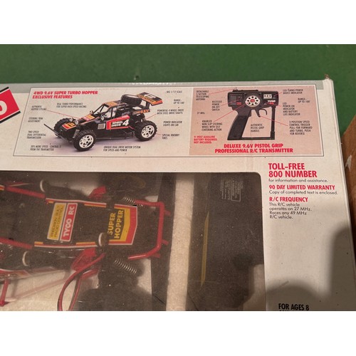 62 - Radio Control 4WD Tyco Racing Car, boxed. 52 cm x 24 cm x 23 cm.

This lot is available for in-house... 