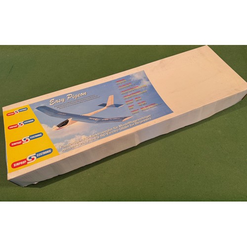 67 - Radio Controlled powered glider model kit, Easy Pigeon,boxed, 95 cm x 30 cm x 9cm.

This lot is avai... 