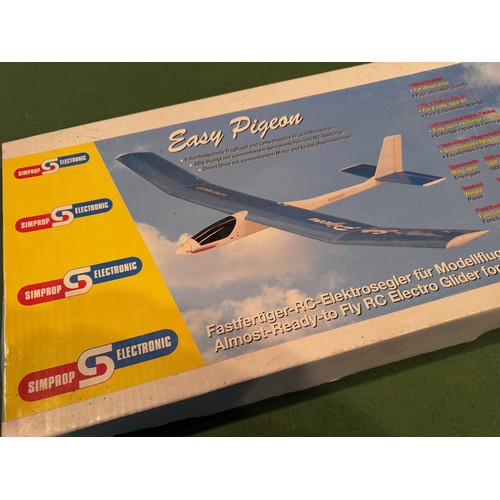 67 - Radio Controlled powered glider model kit, Easy Pigeon,boxed, 95 cm x 30 cm x 9cm.

This lot is avai... 