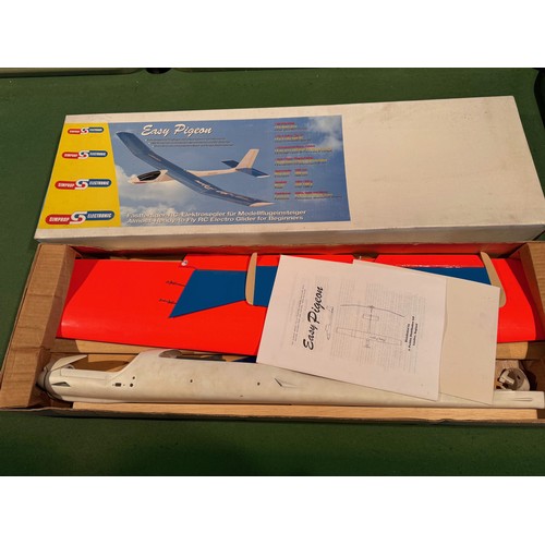 67 - Radio Controlled powered glider model kit, Easy Pigeon,boxed, 95 cm x 30 cm x 9cm.

This lot is avai... 