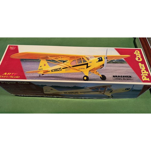 68 - Radio Controlled model aircraft, an Oracover Piper Cub kit, boxed, 103cm x 32 cm x 25 cm.

This lot ... 