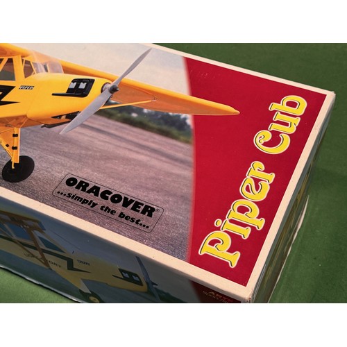 68 - Radio Controlled model aircraft, an Oracover Piper Cub kit, boxed, 103cm x 32 cm x 25 cm.

This lot ... 