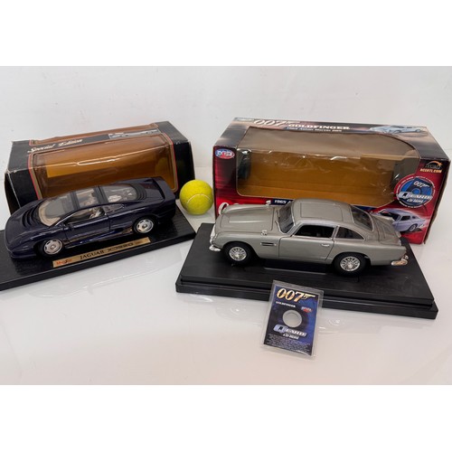 71 - Die cast toys, model cars, a large scale James Bond 007 Aston Martin DB5 and a Jaguar XJ220, both bo... 