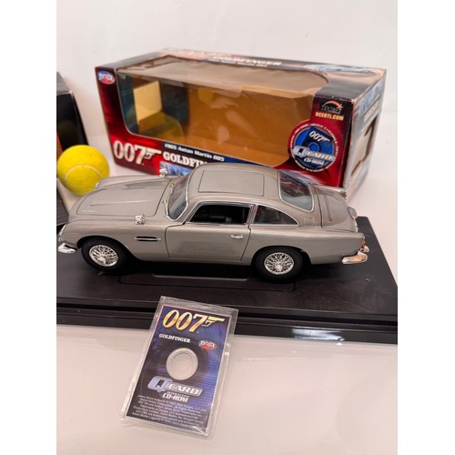 71 - Die cast toys, model cars, a large scale James Bond 007 Aston Martin DB5 and a Jaguar XJ220, both bo... 