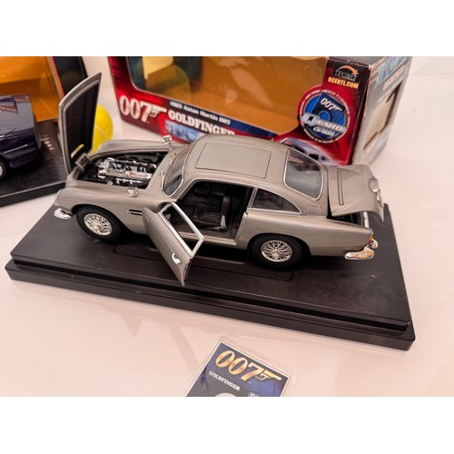 71 - Die cast toys, model cars, a large scale James Bond 007 Aston Martin DB5 and a Jaguar XJ220, both bo... 