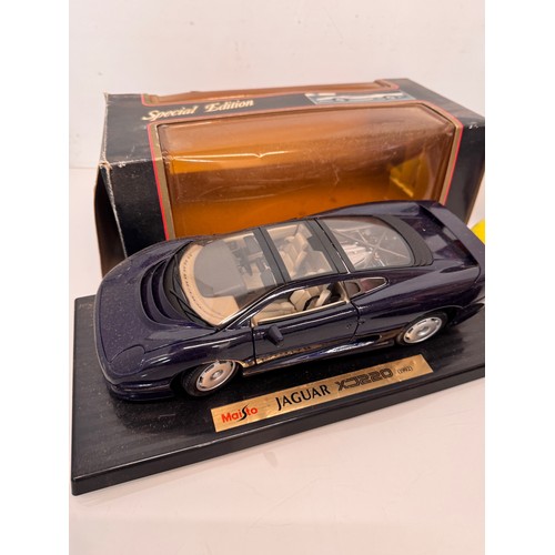 71 - Die cast toys, model cars, a large scale James Bond 007 Aston Martin DB5 and a Jaguar XJ220, both bo... 