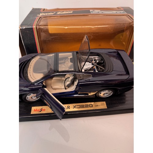 71 - Die cast toys, model cars, a large scale James Bond 007 Aston Martin DB5 and a Jaguar XJ220, both bo... 