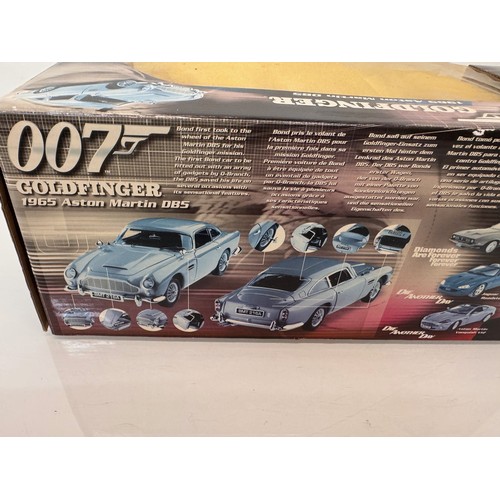 71 - Die cast toys, model cars, a large scale James Bond 007 Aston Martin DB5 and a Jaguar XJ220, both bo... 