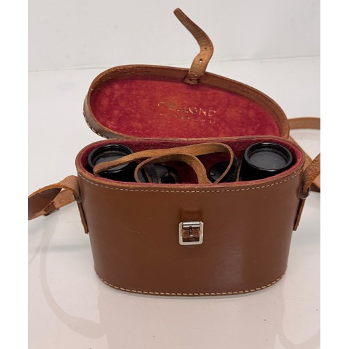 317 - Mid C20th Dolland of London field glasses with a leather case.

This lot is available for in-house s... 