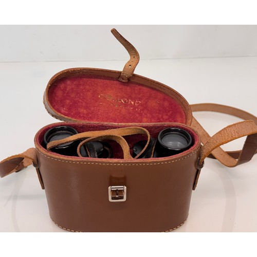 317 - Mid C20th Dolland of London field glasses with a leather case.

This lot is available for in-house s... 